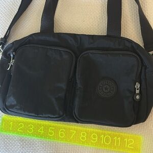 Kipling black hand bag with long strap and handles
